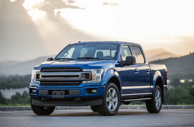 Blue pickup truck on the open road