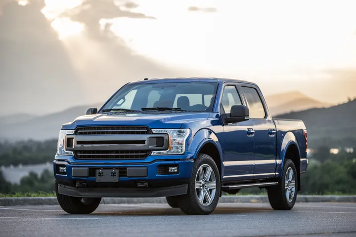 Blue pickup truck on the open road