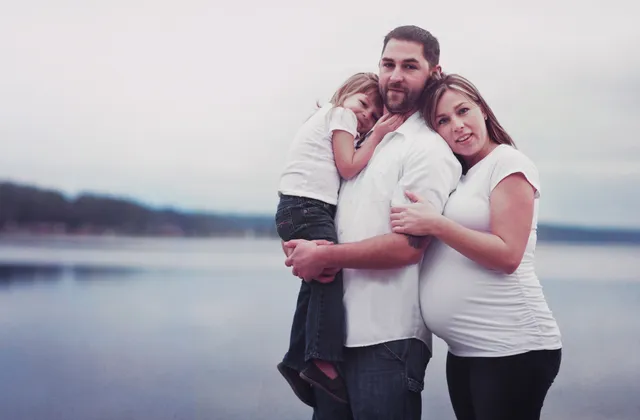 Family portrait outdoors on a sunny day