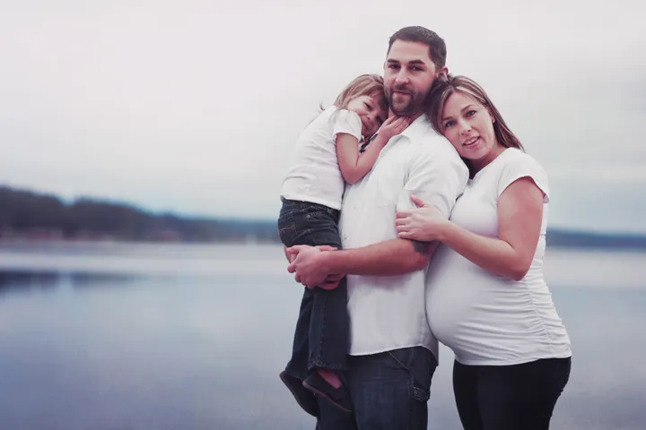 Family portrait outdoors on a sunny day